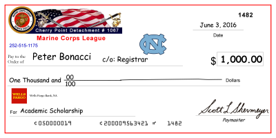 image of large-scale mock check presented to previous scholarship recipient, Peter Bonacci